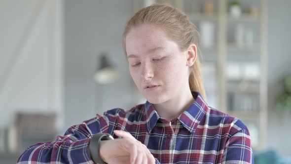 Young Woman Using Smart Watch