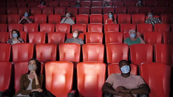 Diverse People in Movie Theater During Coronavirus