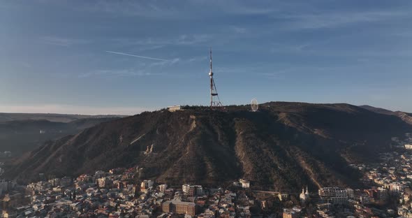 Aerial view of center of Tbilisi under Mtatsminda mountain. Georgia 2022