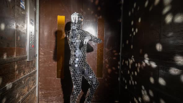 Sparkling Discosuit Man Dancing in a Lift