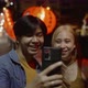 Young Asian couple travel make a video live streaming on social network by smartphone. - VideoHive Item for Sale
