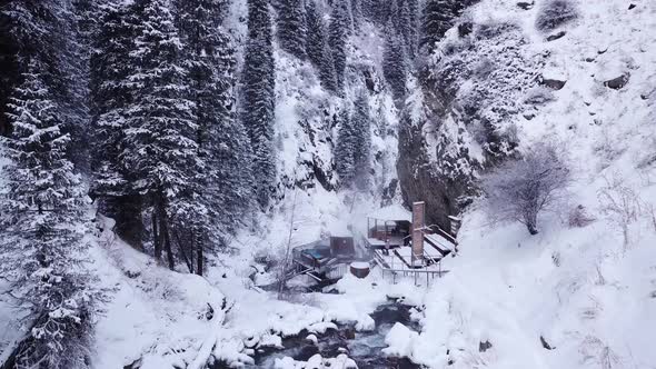 Hot Springs in the Snowy Forest and Mountains