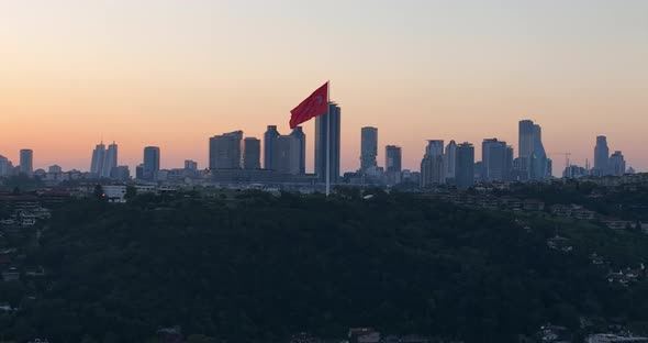 Istanbul Bosphorus Bridge and City Skyline in Background with Turkish Flag at Beautiful Sunset