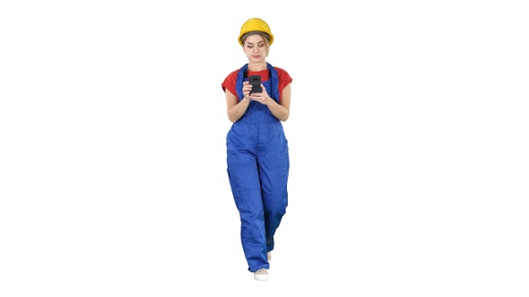 Female worker walking and using phone on white background