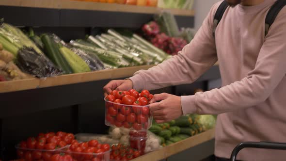 Multiethnic Buyers Choosing Tomatoes in Farm Shop