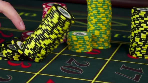 Chips Falling on Green Roulette Table at Casino, Slow Motion