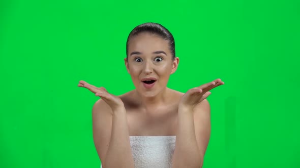 Very Surprised Girl in White Towel and Wow Face Expression on Green Screen. Slow Motion