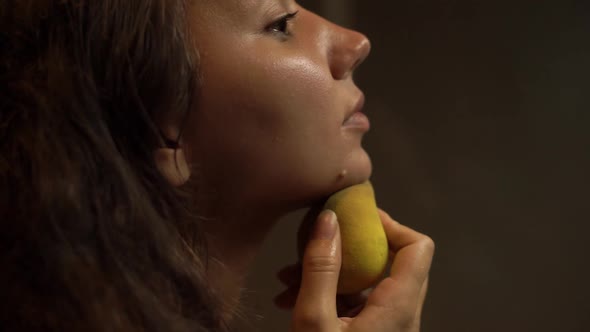 Brunette Lady Removes Makeup Base Layer with Yellow Sponge