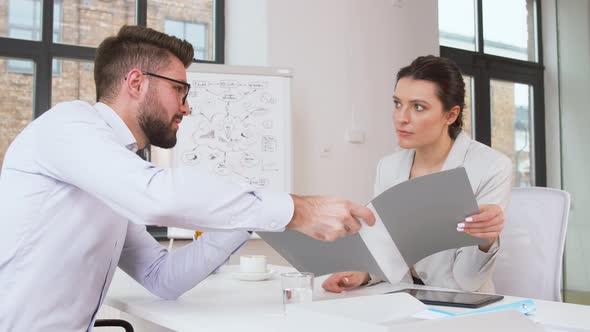 Employer Having Interview with Employee at Office