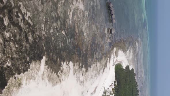 Vertical Video of Low Tide in the Ocean Near the Coast of Zanzibar Tanzania Aerial View