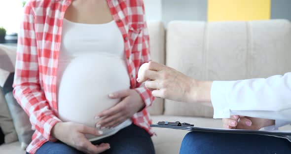 Doctor Prescribes Medicines or Vitamins to Pregnant Woman