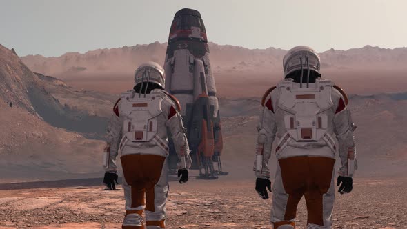Astronaut Wearing Space Suit Walking on the Surface of Mars alt