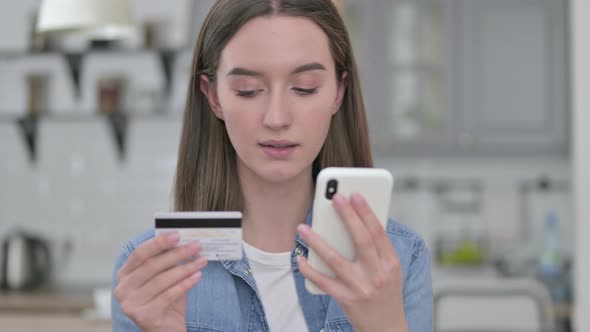 Portrait of Young Woman Making Online Payment on Smartphone 
