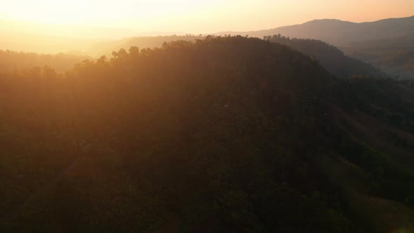 4K Aerial view over beautiful mountains. beautiful sunset over high mountains