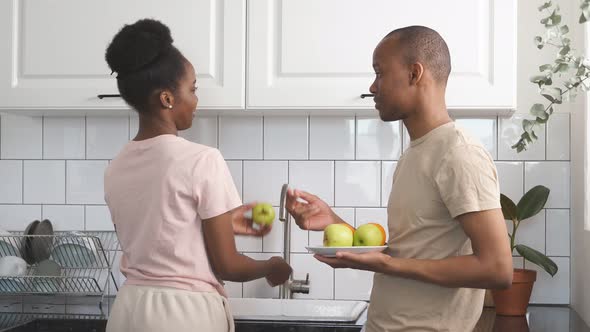 Young Married Couple Is Preparing Breakfast
