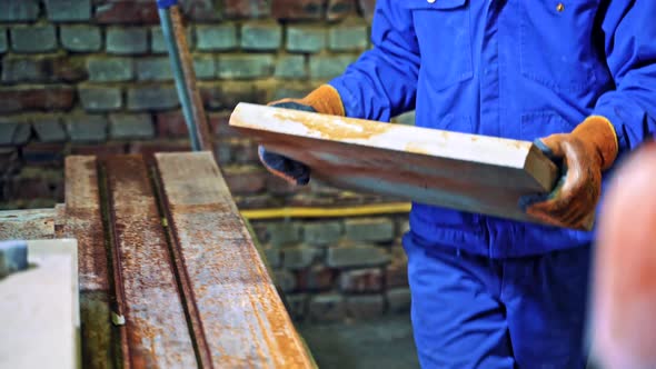 Male worker at stone factory. Industrial worker at factory on granite manufacturer