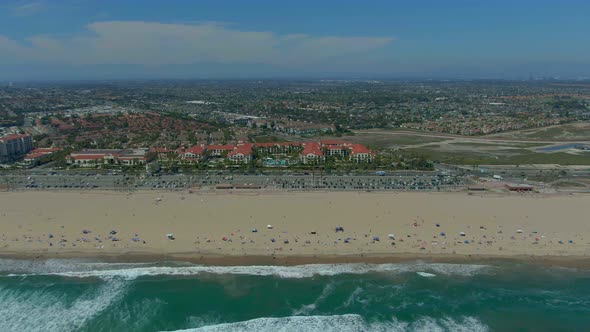 Drone flying away from a Huntington Beach.