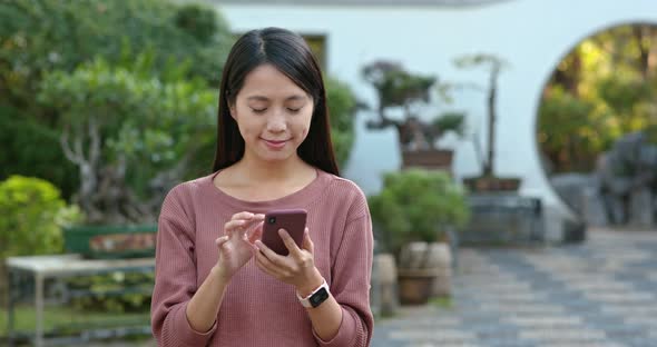 Woman send sms on cellphone