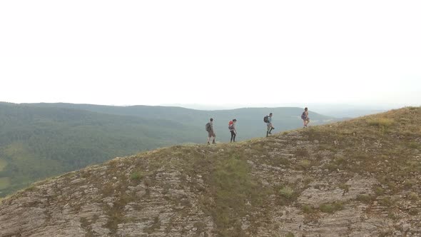 Group of four friends hiking in Umbria, Italy