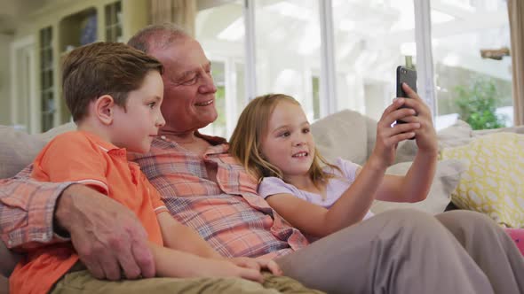 Senior Caucasian man with grandchildren