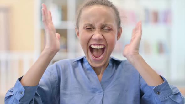 Portrait of Annoyed African Woman Screaming Shouting