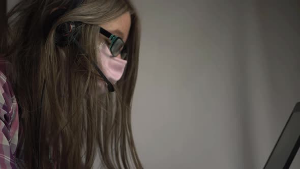 Woman with mask and glasses and headset medium shot