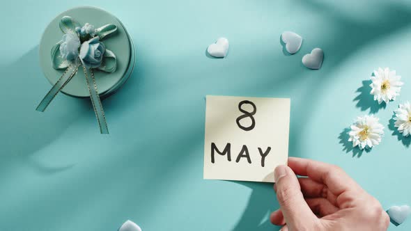 May 8 Date for Mother's Day on a Light Blue Background