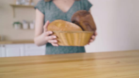 Lady Carries Organic Bread Loaves To Stylish Table Closeup