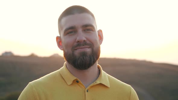 Close Up, Portrait of a Handsome Caucasian Bearded Young Man Looking To the Camera and To the Side