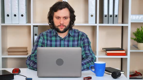 Employee Using Computer Indoors 