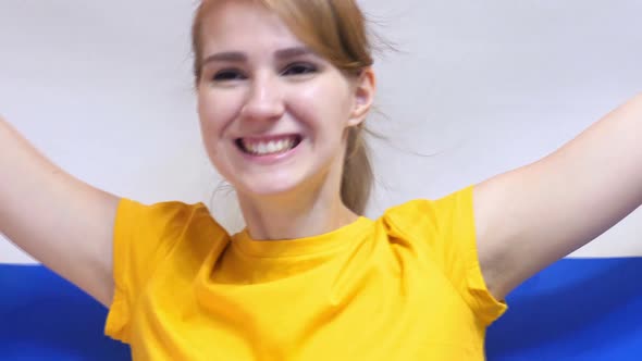 Netherlands Young Woman Celebrating While Holding the Flag of Netherlands in Slow Motion