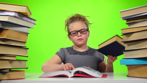Girl Chooses an Interesting Book and Reads. Green Screen. Slow Motion