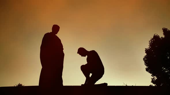 Man Kneels Before the Priest