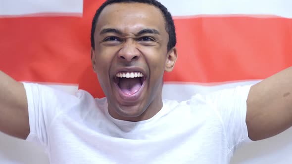 English Fan Celebrates Holding the Flag of England in Slow Motion