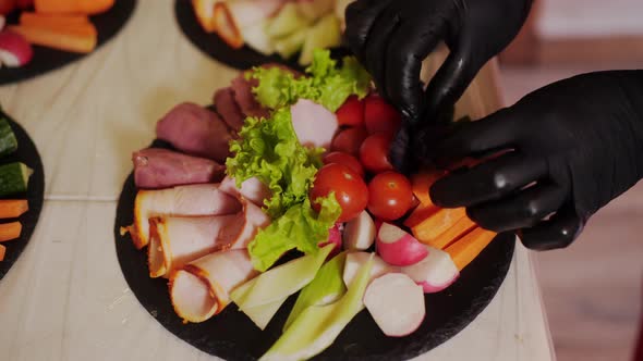 Closeup View of Chef Decorating Delicious Meal with Basil Leaves