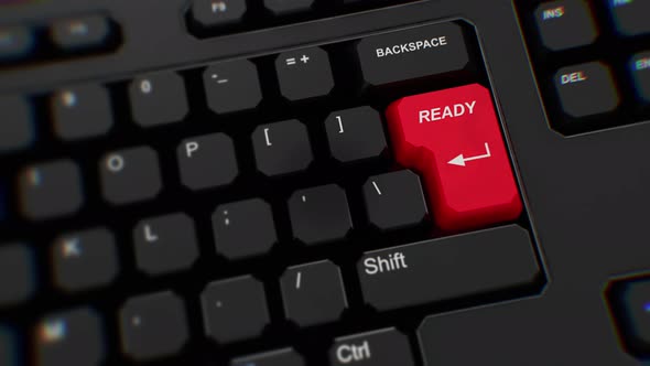 Ready button on keyboard. A finger presses Enter. Click ready. Realistic keyboard button. Red button