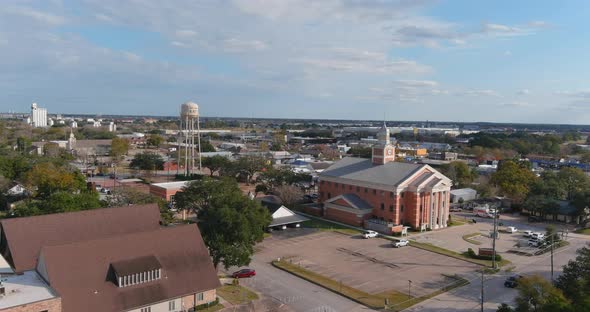 4k aerial view of downtown Katy, Texas. In this establishing shot is a view of Katy City Hall.