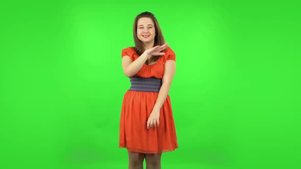 Cute Girl Is Smiling and Dancing Funny. Green Screen