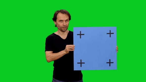 Man Speaking While Doing Presentation With Blank Mockup Board on Screen