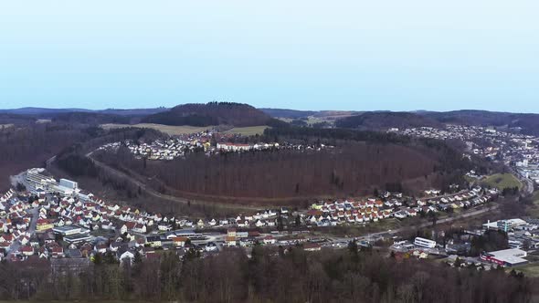 Aerial view of the recreation area of the Swabian Alb town Albstadt, flying backwards with the drone