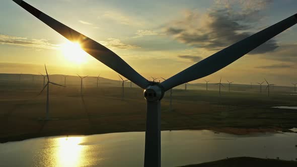 Windmills or Wind Turbine in Sunset Light