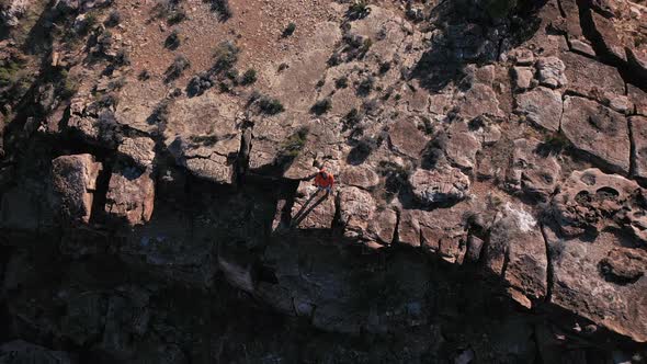 Young photographer in canyon