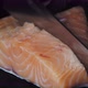 Closeup of a Chef in Gloves Slicing Fresh Salmon - VideoHive Item for Sale