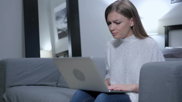 Woman Sad for Failure Working on Laptop