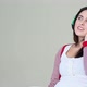 Teenage girl wearing headphones and listening to music - VideoHive Item for Sale