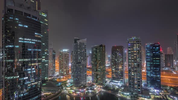 Residential and Office Buildings in Jumeirah Lake Towers District Night Timelapse in Dubai