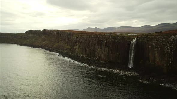 Aerial Pan of a Waterfall on the Cliffs of Skye Near Neist Point