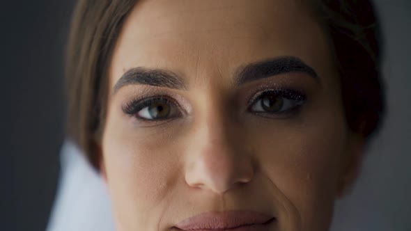 Close up of Woman opening beautiful eyes. Female model with natural make-up