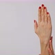 Beautiful Woman's Hands with Bright Red Manicure, One Hand Gently Massaging the Other - VideoHive Item for Sale