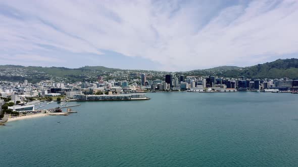 Aerial of Wellington city and Harbour during a lovely sunny day in New Zealand with a beautiful clou